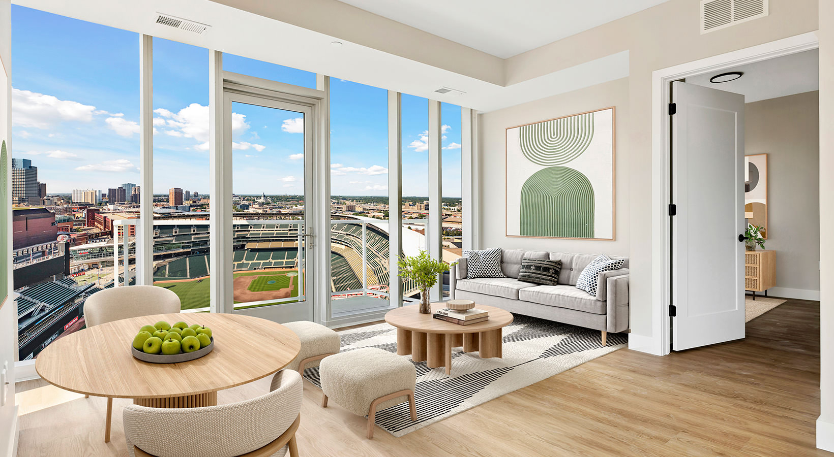 living room with couch and view of a baseball field