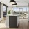 spacious, open kitchen surrounded by large windows and city views
