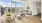 dining area and living room with floor-to-ceiling windows