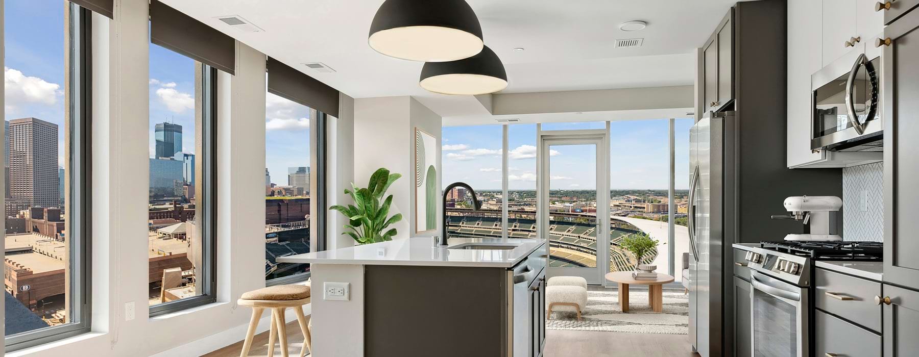 spacious, open kitchen surrounded by large windows and city views