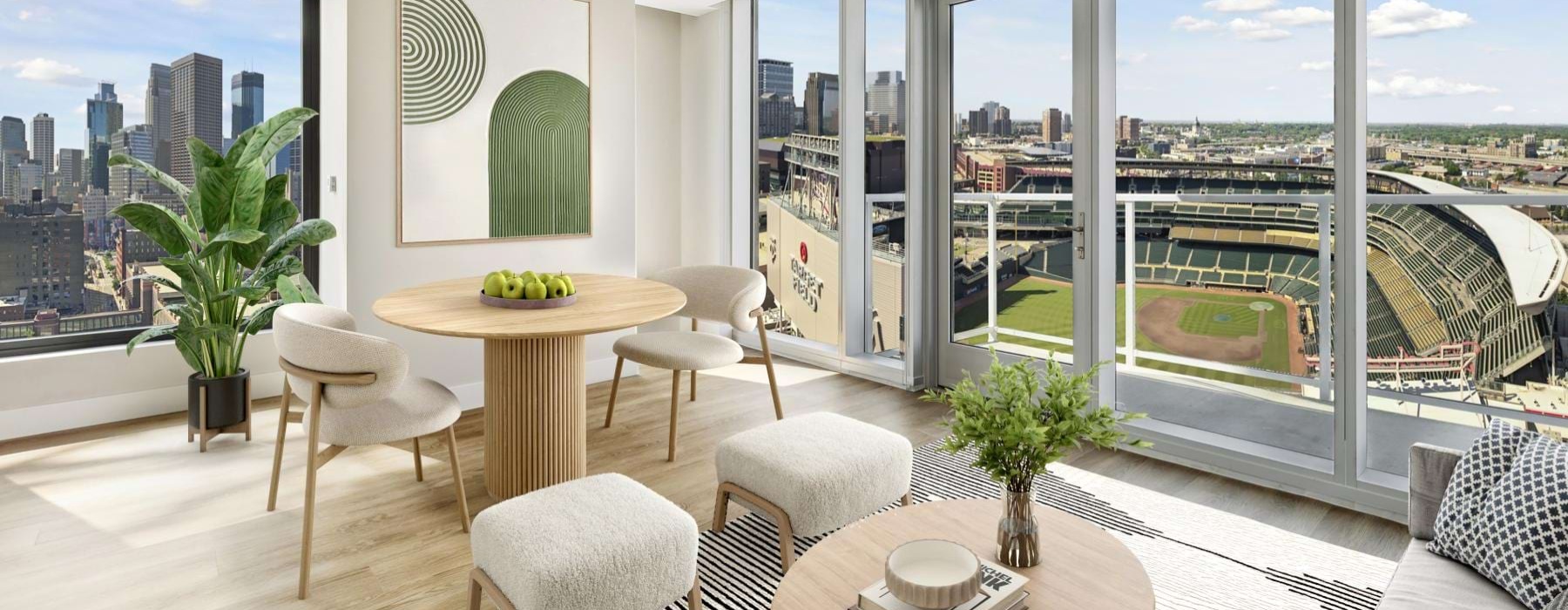open concept living room and dining area surrounded by picture windows offering fantastic city views
